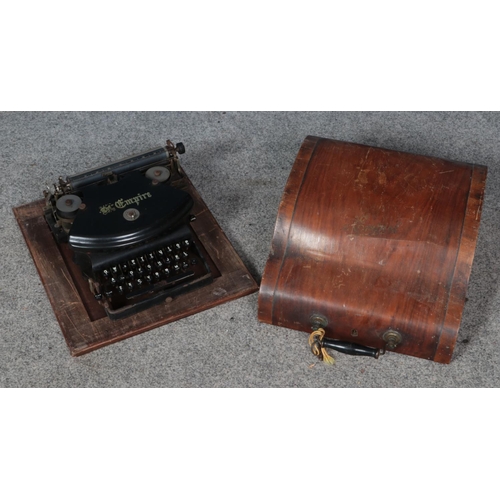 353 - A cased The Empire typewriter.