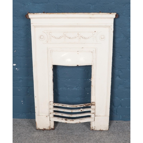 357 - A painted cast iron fire plate. Dimensions 60cm x 97cm.