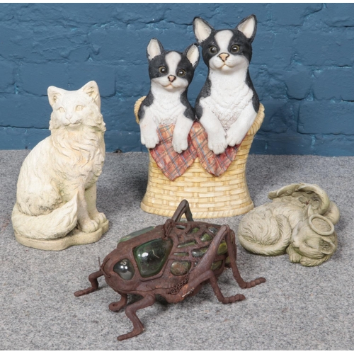 360 - A collection of garden ornaments; including composite cat doorstop/stick stand, concrete cat feature... 