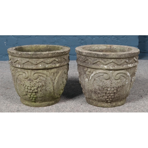 364 - A pair of small concrete planters. Height 28cm, Diameter 32cm.