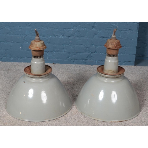 372 - Two industrial grey enamel light shades.