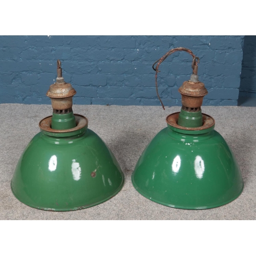 373 - Two industrial green enamel light shades.