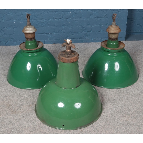 374 - Three industrial green enamel light shades.