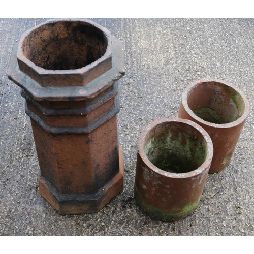 378 - Three chimney pots. Largest example (71cm)