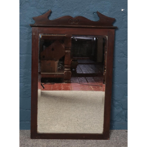 386 - A mahogany bevel edged fret mirror. 78cm tall.