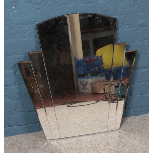 406 - An Art Deco style mirror. Dimensions 71cm x 71cm (at widest point).