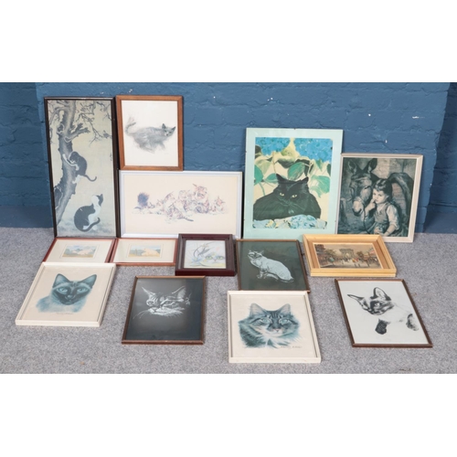 408 - A large quantity of pictures and prints, to include several depicting cats. Includes framed watercol... 