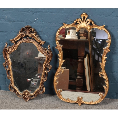 411 - Two ornate gilt framed wall mirrors.