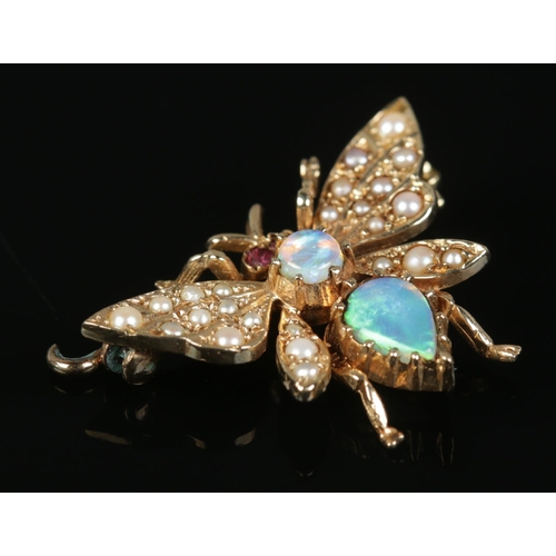 439 - A 9ct Gold brooch, set with opals and seed pearls, in the form of a bee. Total weight: 3.74g