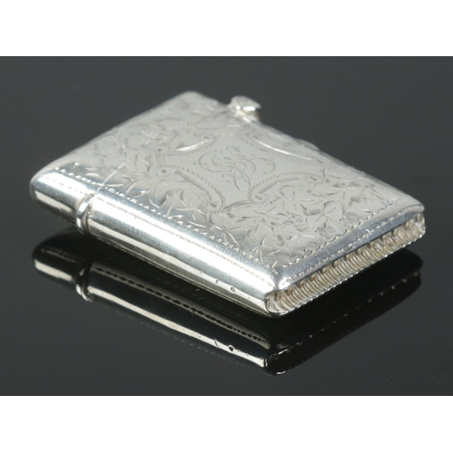 459 - An Edwardian silver vesta case with engraved decoration and cartouche. Assayed for Birmingham, 1903 ... 