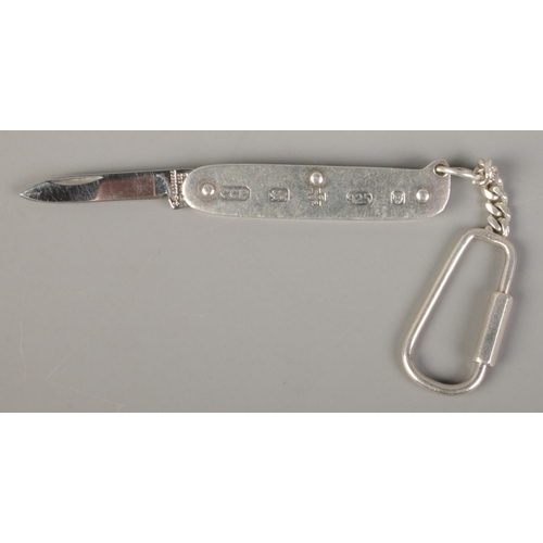 466 - A silver handled pen knife. The blade stamped for Rodgers. Assayed London 2000 by Chamberlain Clarke... 