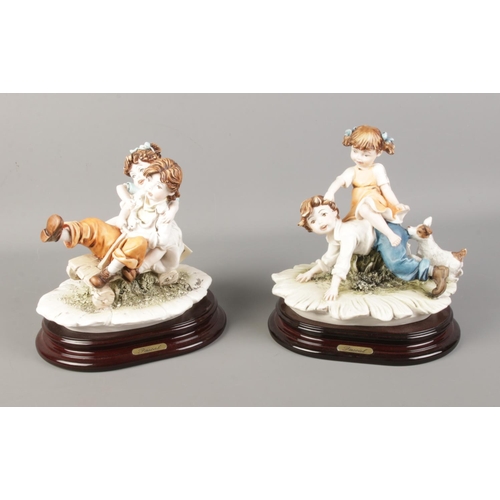 76 - Two Capodimonte style figures by Berger depicting two children playing.