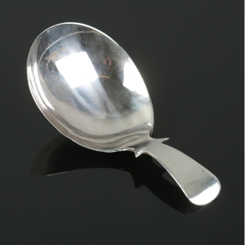 487 - A George III silver caddy spoon. Assayed for Birmingham, 1812. Total weight: 6.88g.