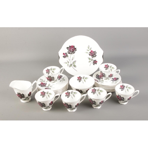 77 - A Royal Albert china tea set featuring rose pattern. Approx. 23 pieces including tea cups and saucer... 