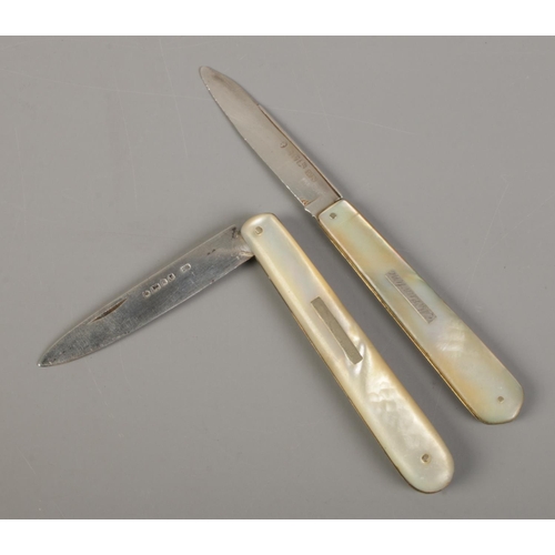 501 - Two Victorian silver bladed and mother of pearl folding fruit knives, one with bar insert inscribed ... 