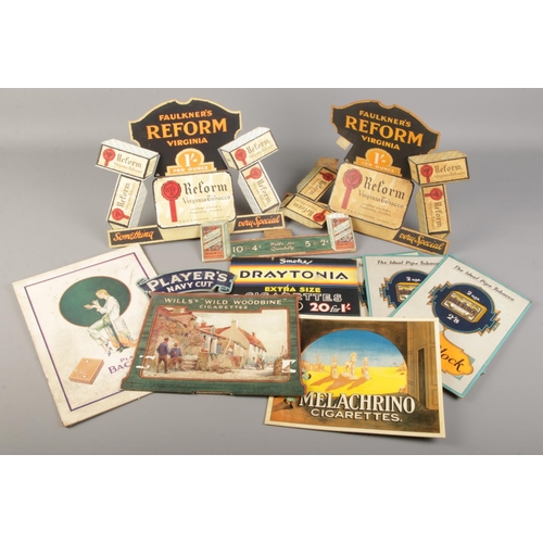 84 - A collection of vintage tobacco and cigarette related display stands.