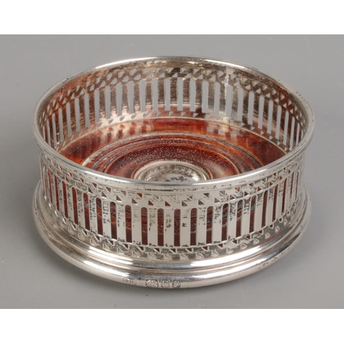 509 - A silver and wooden base wine coaster. Assayed for London, 1998 by John Bull Ltd.