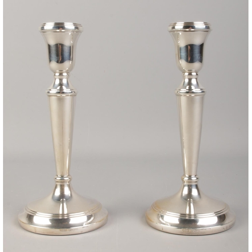 511 - A pair of silver filled candlesticks, assayed for Birmingham, 1997 by John Bull Ltd. Height: 19cm.