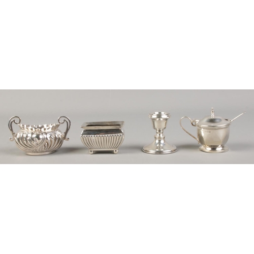 516 - A collection of table silver. To include mustard pot with blue glass liner and spoon, two silver sal... 