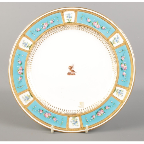 519 - A late 19th century Minton porcelain plate with gilt and turquoise border decorated with hand painte... 