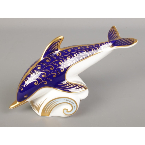 533 - A Royal Crown Derby paperweight formed as a dolphin.