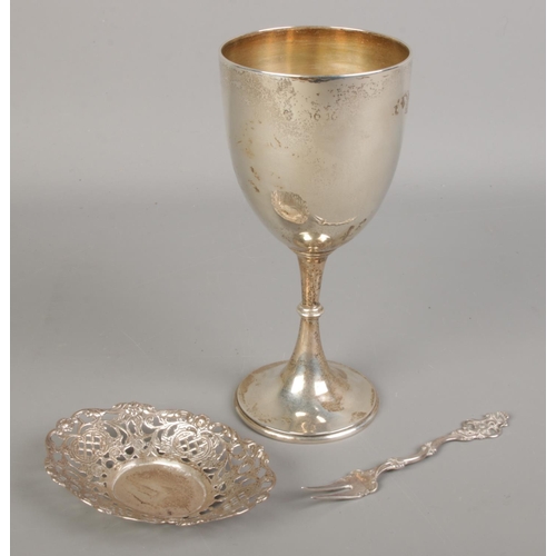 534 - A silver goblet along with a white metal pierced dish and a Swedish silver fork.