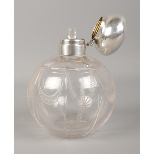 539 - A silver topped globular scent bottle, with engine turned decoration. Assayed for Birmingham, 1916. ... 