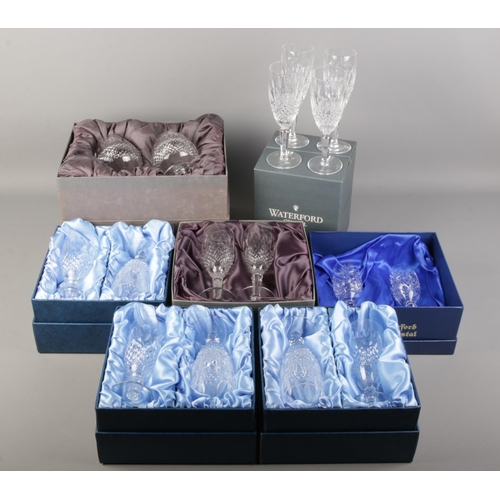 541 - A quantity of boxed Waterford crystal glasses. Including champagne flutes, etc.