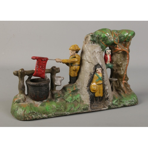 91 - A novelty cast iron money box 'Boy Scout Camp'.