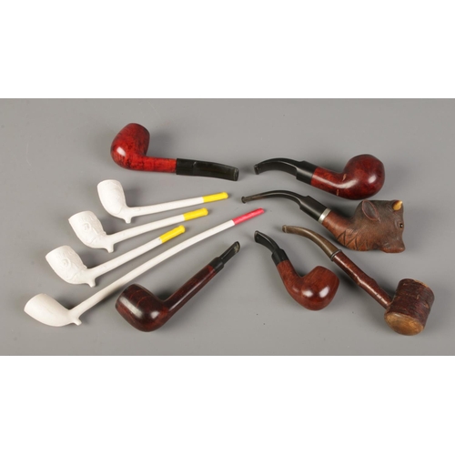 94 - A collection of pipes, to include clay and 'Best Briar' examples.