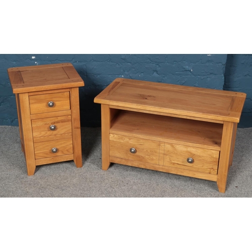 554 - A modern bed side table set of drawers along with a matching cabinet.