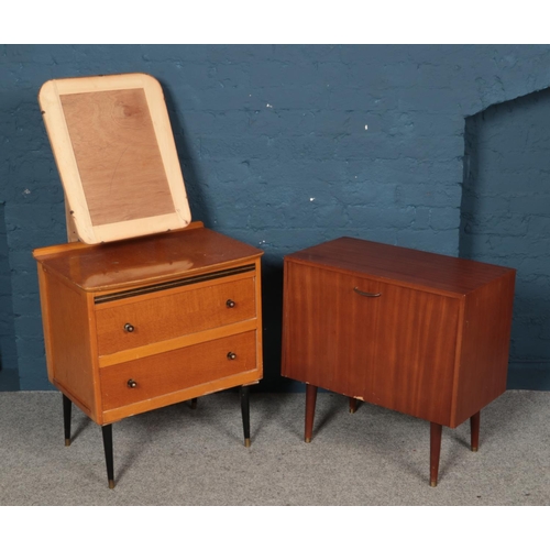 562 - A three drawer dressing table with built in mirror frame (mirror is missing) along with record cabin... 