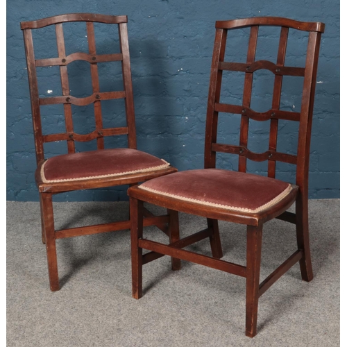 563 - A pair of mahogany open lattice back chairs, with fabric upholstered seats.