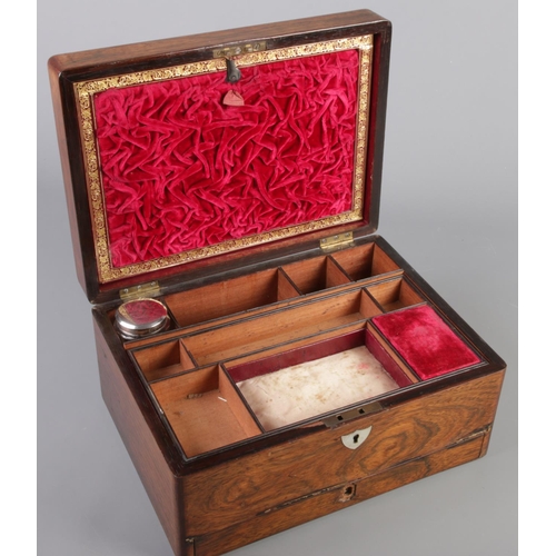 119 - A Victorian rosewood box with mother of pearl inlay and fitted interior.