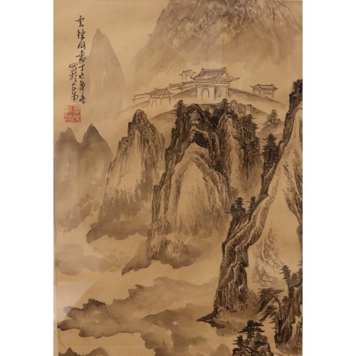 293 - A framed Chinese watercolour on material, depicting landscape scenes and calligraphy. 40cm x 28cm.