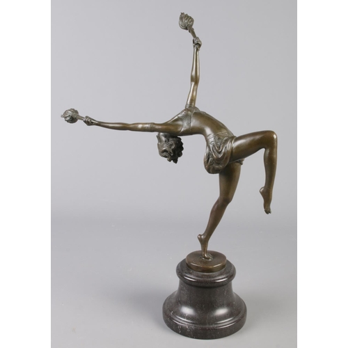 122 - An Art Deco style bronze figure modelled as a fire dancer, raised on marble base. Signed indistinct.... 