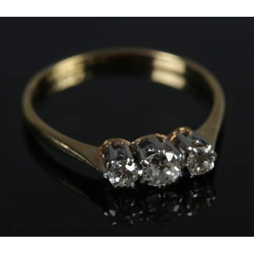 344 - An antique 18ct gold and platinum diamond three stone ring. Size P. 2.06g