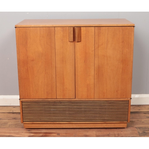 502 - A vintage teak Decca Colour TV cabinet with folding hinged doors, on casters. Height: 78cm, Width: 7... 