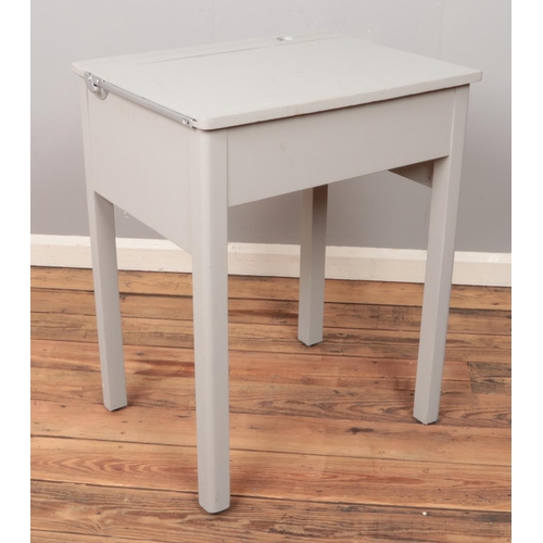 505 - A grey painted wooden desk.