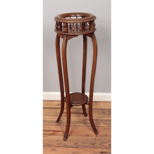 508 - A 19th walnut jardiniere. Approx. 99cm tall.