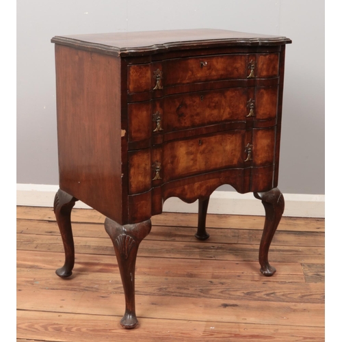 510 - A Queen Anne style walnut chest of drawers raised on cabriole supports.