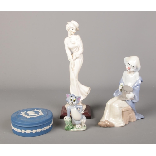 108 - A small collection of ceramics, including Nao clown, Wedgwood jasperware trinket dish and Wade Tom f... 