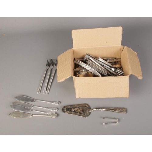 115 - A box of assorted flatware including silver plated knives, forks and cake slice. Also includes pair ... 