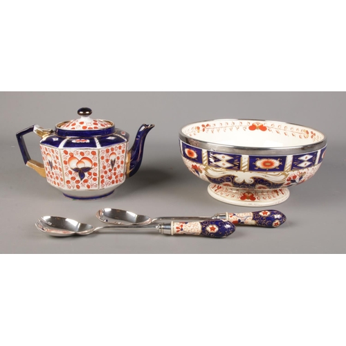 133 - A Taylor Tunnicliffe salad bowl and servers, together with a similar teapot, both in Imari colours.