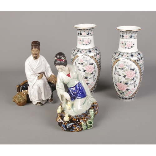 136 - A quantity of oriental ceramics to include pair of floral vases and pair of figures. One figure is d... 