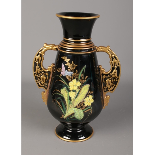 137 - A Victorian vase featuring floral motif. Some damage to central flower design. Approx. height 33cm.