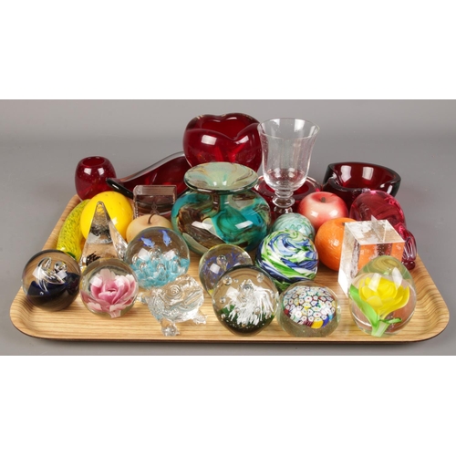 143 - A tray of glassware. Including paperweights, fruit, white friars, glass with bubble inclusions, etc.