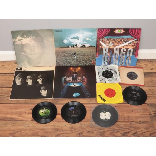 144 - A quantity of records to include Beatles and associated solo artists such as Imagine, Ringo and seve... 