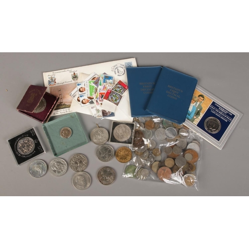 147 - A box of British and world coins, stamps, medals etc.