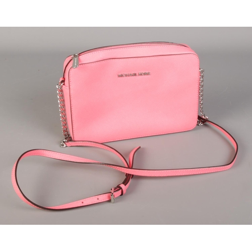 159 - A Michael Kors pink handbag.